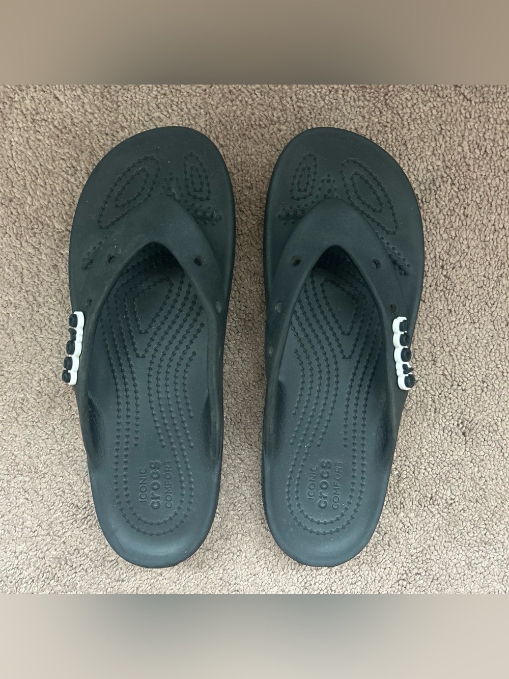 Black Crocs flip flops